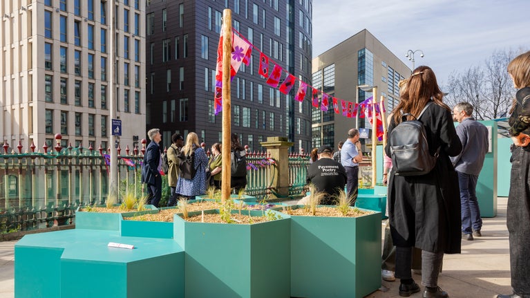 Visitors at the Station Sanctuary garden at Manchester Piccadilly